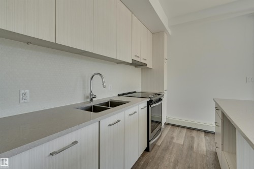206 10837 83 Avenue, Edmonton, AB - Indoor Photo Showing Kitchen With Double Sink With Upgraded Kitchen