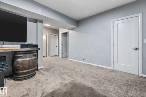 Living room featuring carpet and baseboards - 14 Spring Bay, Spruce Grove, AB - Indoor Photo Showing Other Room