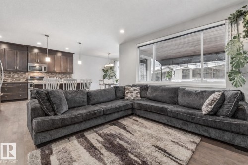 Living area with light wood-style flooring and recessed lighting - 14 Spring Bay, Spruce Grove, AB - Indoor Photo Showing Living Room