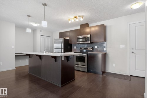 406 3353 16A Avenue, Edmonton, AB - Indoor Photo Showing Kitchen With Stainless Steel Kitchen With Upgraded Kitchen