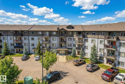 View of apartment building / complex with uncovered parking - 357 1196 Hyndman Road, Edmonton, AB - Outdoor With Facade