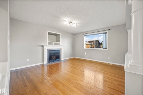 144 55 Street, Edmonton, AB - Indoor Photo Showing Living Room With Fireplace