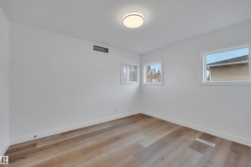 Unfurnished room with light wood-style floors and baseboards - 5021 46 Avenue, Calmar, AB - Indoor Photo Showing Other Room