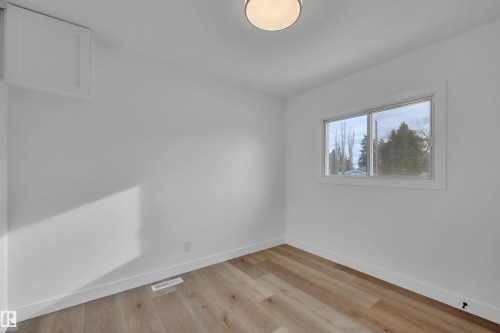 Spare room featuring light wood-style flooring and baseboards - 5021 46 Avenue, Calmar, AB - Indoor Photo Showing Other Room