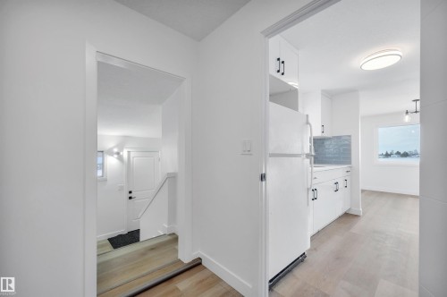 Hallway featuring light wood finished floors and baseboards - 5021 46 Avenue, Calmar, AB - Indoor Photo Showing Other Room
