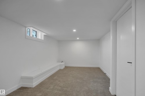 Below grade area featuring light colored carpet and recessed lighting - 5021 46 Avenue, Calmar, AB - Indoor Photo Showing Other Room