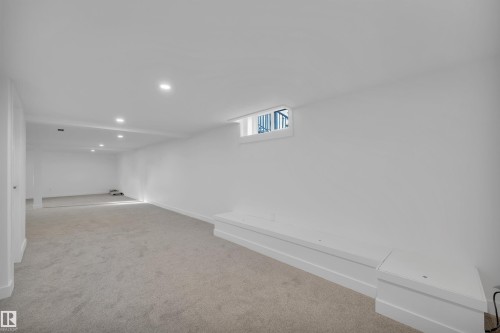 Below grade area featuring light carpet and recessed lighting - 5021 46 Avenue, Calmar, AB - Indoor Photo Showing Other Room