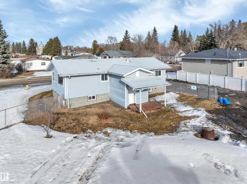 Snowy aerial view featuring a residential view - 5021 46 Avenue, Calmar, AB - Outdoor