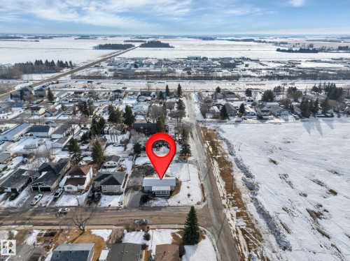 Snowy aerial view with a residential view - 5021 46 Avenue, Calmar, AB - Outdoor With View