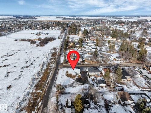 Snowy aerial view featuring a residential view - 5021 46 Avenue, Calmar, AB - Outdoor With View