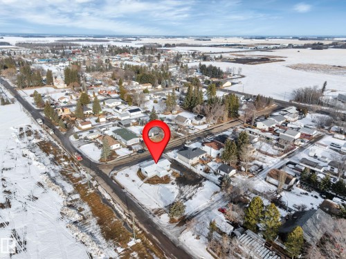 Snowy aerial view with a residential view - 5021 46 Avenue, Calmar, AB - Outdoor With View