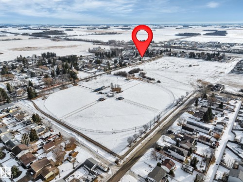 Snowy aerial view featuring a residential view - 5021 46 Avenue, Calmar, AB - Outdoor With View
