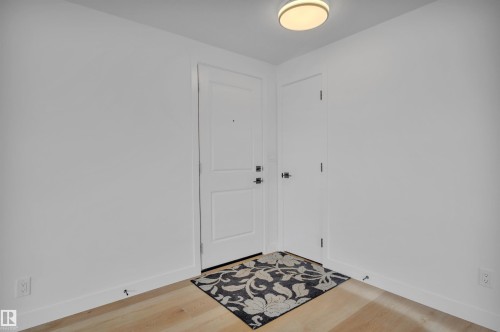 Entryway with light wood-style floors and baseboards - 5021 46 Avenue, Calmar, AB - Indoor Photo Showing Other Room