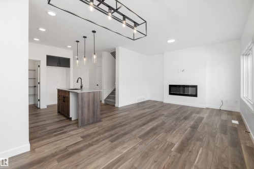 1166 South Creek Wynd, Stony Plain, AB - Indoor Photo Showing Other Room With Fireplace