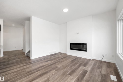 1166 South Creek Wynd, Stony Plain, AB - Indoor Photo Showing Living Room With Fireplace