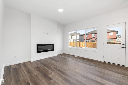 1166 South Creek Wynd, Stony Plain, AB - Indoor Photo Showing Living Room With Fireplace