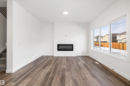 1166 South Creek Wynd, Stony Plain, AB - Indoor Photo Showing Living Room With Fireplace