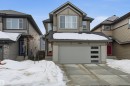 View of front of home with a garage, entry steps, driveway, and a shingled roof - 9882 225A St Nw, Edmonton, AB  - Outdoor With Facade 