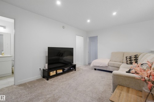 Living room featuring light carpet and recessed lighting - 9882 225A St Nw, Edmonton, AB - Indoor Photo Showing Living Room