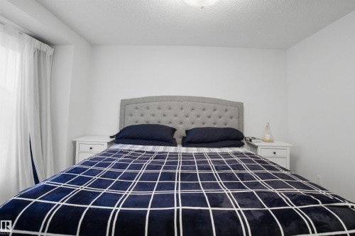 Bedroom with a textured ceiling - 9882 225A St Nw, Edmonton, AB - Indoor Photo Showing Bedroom