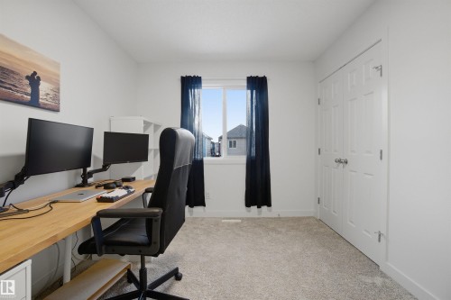 Office area with light carpet and baseboards - 9882 225A St Nw, Edmonton, AB - Indoor Photo Showing Office