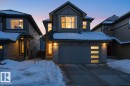 Modern home with a garage, driveway, and entry steps - 9882 225A St Nw, Edmonton, AB  - Outdoor With Facade 