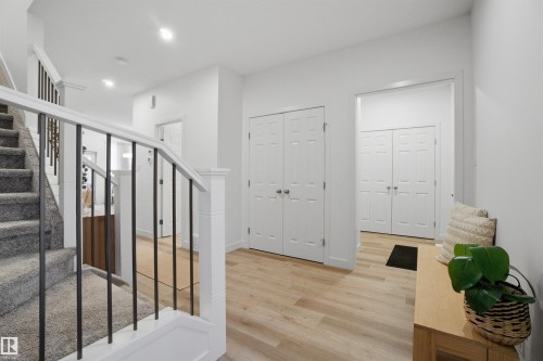 Stairs featuring wood finished floors and recessed lighting - 9882 225A St Nw, Edmonton, AB - Indoor Photo Showing Other Room