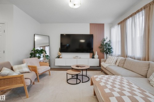 Living area featuring wood finished floors - 9882 225A St Nw, Edmonton, AB - Indoor Photo Showing Living Room