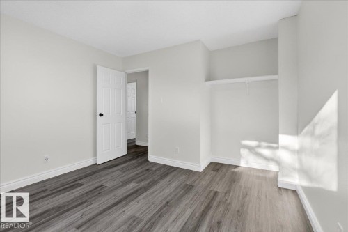Unfurnished bedroom with wood finished floors and baseboards - 133 Habitat Crescent, Edmonton, AB - Indoor Photo Showing Other Room
