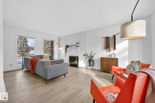 10523 17 Avenue Nw, Edmonton, AB - Indoor Photo Showing Living Room With Fireplace