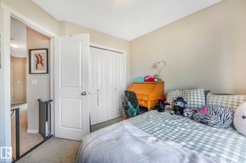 Carpeted bedroom with a closet - 91 603 Watt Boulevard, Edmonton, AB - Indoor Photo Showing Bedroom