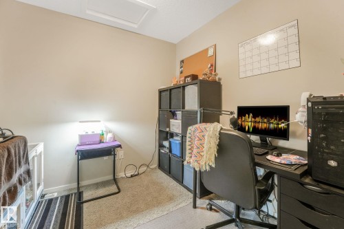 Carpeted office space with attic access and baseboards - 91 603 Watt Boulevard, Edmonton, AB - Indoor Photo Showing Office