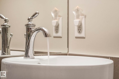 Bathroom view of a sink and a wainscoted wall - 91 603 Watt Boulevard, Edmonton, AB - Indoor