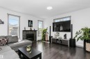 7703 Getty Wynd, Edmonton, AB  - Indoor Photo Showing Living Room With Fireplace 