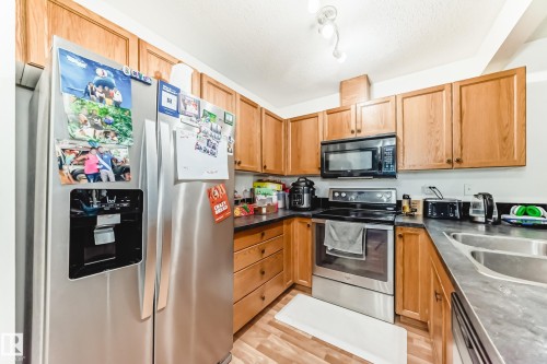 38-150 Edwards Drive Sw, Edmonton, AB - Indoor Photo Showing Kitchen With Stainless Steel Kitchen With Double Sink