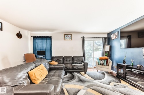 38-150 Edwards Drive Sw, Edmonton, AB - Indoor Photo Showing Living Room With Fireplace
