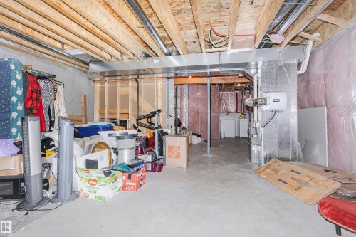 Unfinished basement with heating unit - 2855 16 Avenue, Edmonton, AB - Indoor Photo Showing Basement