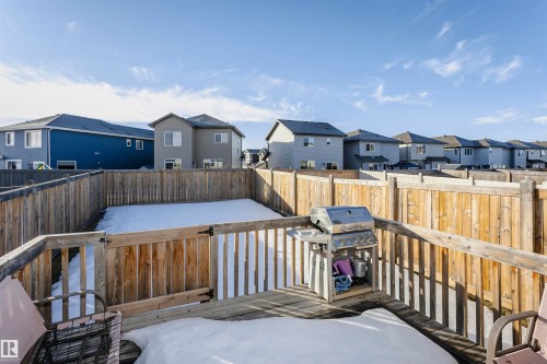 Wooden terrace with a residential view, area for grilling, and a fenced backyard - 2855 16 Avenue, Edmonton, AB - Outdoor With Deck Patio Veranda With Exterior