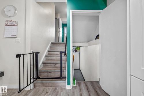 Staircase featuring wood finished floors and baseboards - 11 Grandview Ridge, St. Albert, AB - Indoor Photo Showing Other Room