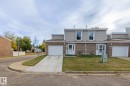 Traditional-style home with concrete driveway, brick siding, and an attached garage - 11 Grandview Ridge, St. Albert, AB  - Outdoor 
