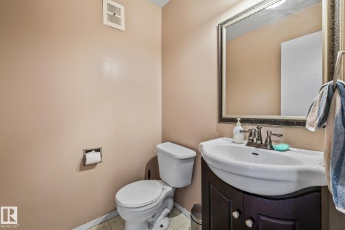 Half bath featuring vanity and tile patterned flooring - 11 Grandview Ridge, St. Albert, AB - Indoor Photo Showing Bathroom