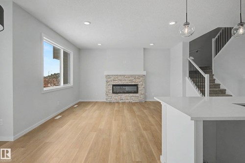 5433 Hawthorn Run, Edmonton, AB - Indoor Photo Showing Living Room With Fireplace