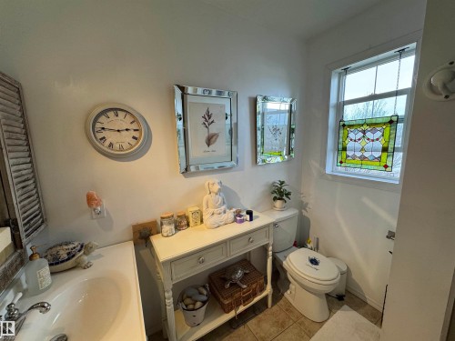 Laundry area featuring washer and dryer with carpeted floors - 208 178 Bridgeport Boulevard, Leduc, AB - Indoor