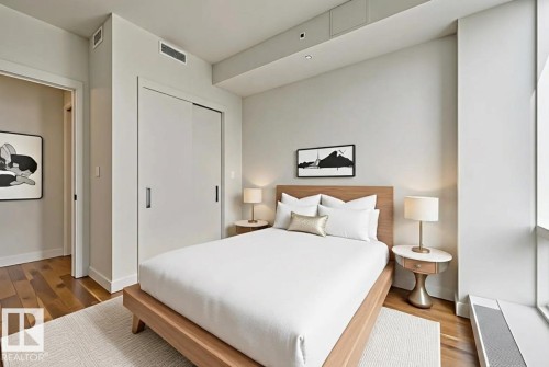 Bedroom featuring wood finished floors and a closet - 3704 10360 102 Street, Edmonton, AB - Indoor Photo Showing Bedroom