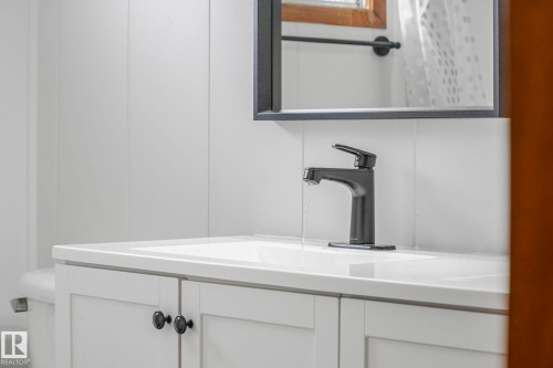 Bathroom featuring vanity and curtained shower - 6007 95 Avenue, Edmonton, AB - Indoor Photo Showing Bathroom
