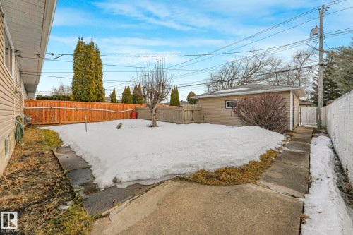 Yard layered in snow featuring a fenced backyard - 6007 95 Avenue, Edmonton, AB - Outdoor