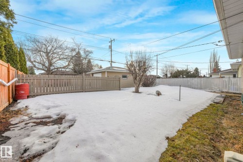 Snowy yard with a fenced backyard - 6007 95 Avenue, Edmonton, AB - Outdoor