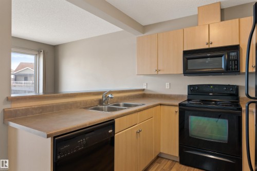 16423 56 Street, Edmonton, AB - Indoor Photo Showing Kitchen With Double Sink