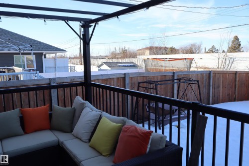 Deck with outdoor furniture and a fenced backyard - 9760 - 107 Street, Westlock, AB - Outdoor With Exterior