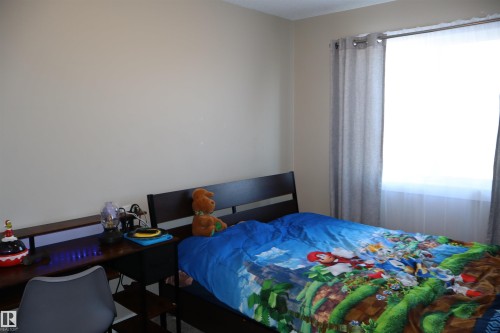 Bedroom with a desk - 9760 - 107 Street, Westlock, AB - Indoor Photo Showing Bedroom